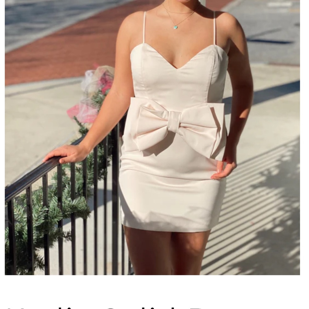 Beautiful cocktail dress with bow detail worn once